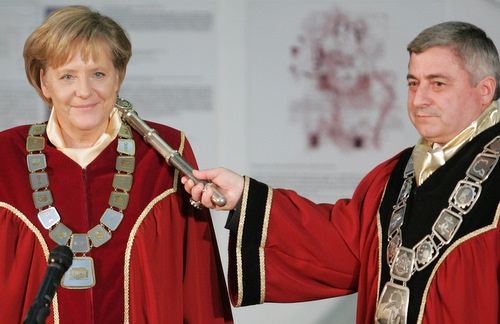 German Chancellor Merkels smiles as she receives the doctor honoris causa title from Ruse University President Hristo Beloev (right). Photo by BGNES